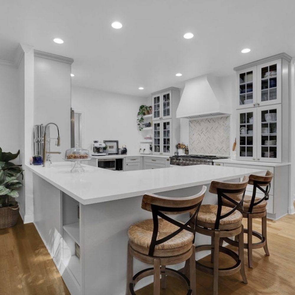 Kitchen remodel with whiite countertops and white cabinets